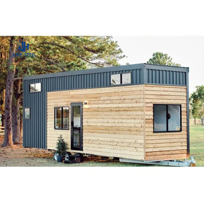 Casa de contenedores prefabricada con vigas de acero sólidas en forma de H y puertas de paneles sandwich